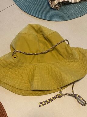 Zara women's yellow bucket hat with purple adjustable cord